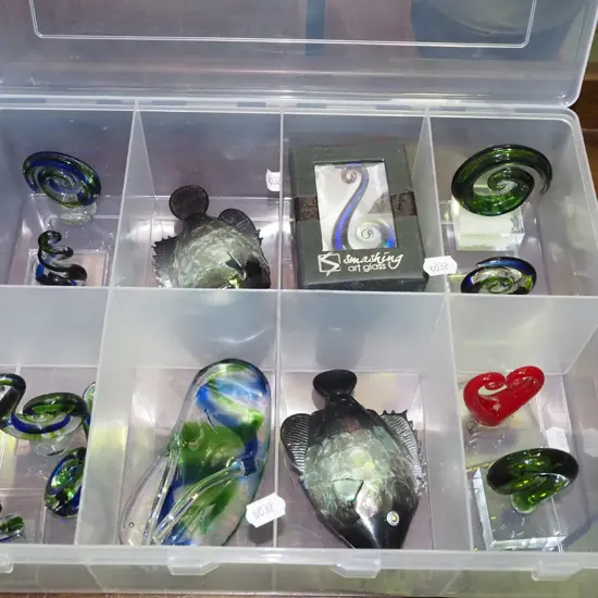 plastic organiser of various glass ornaments 