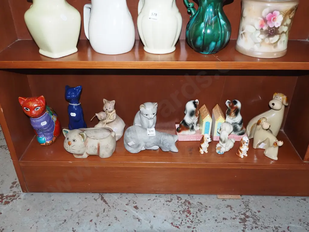 shelf of cat and dog figurines Image 1++