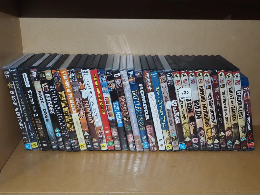 shelf of cowboy DVDs Image 1++