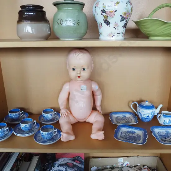 plastic baby doll, miniature tea set