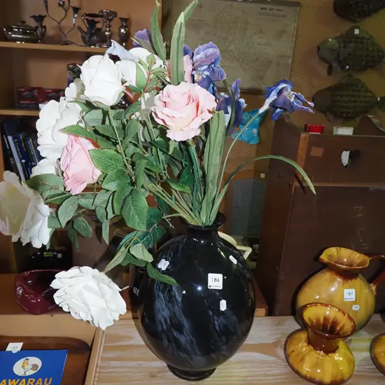 faux flowers in black swirl patterned glazed vase H350