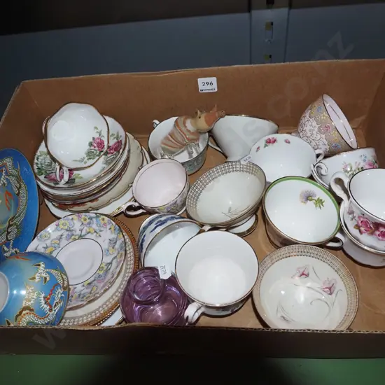 box; cups, saucers, glass and sand rhinoceros