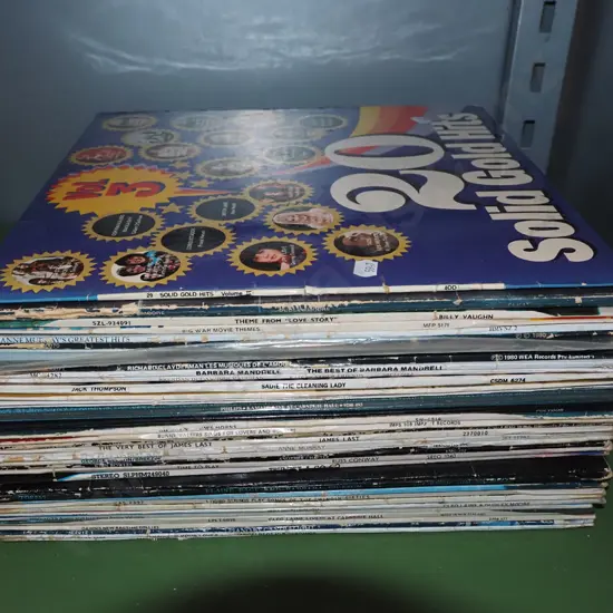 stack of various LPs; Solid Gold Hits, Richard Clayderman etc