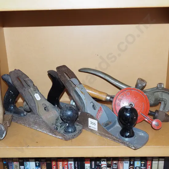 shelf of tools; knibbler, planes, hammer etc
