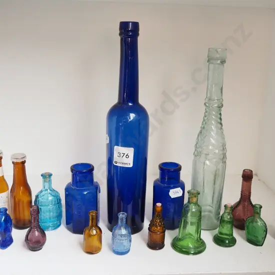 shelf; various coloured bottles, other bottles Tallest H270
