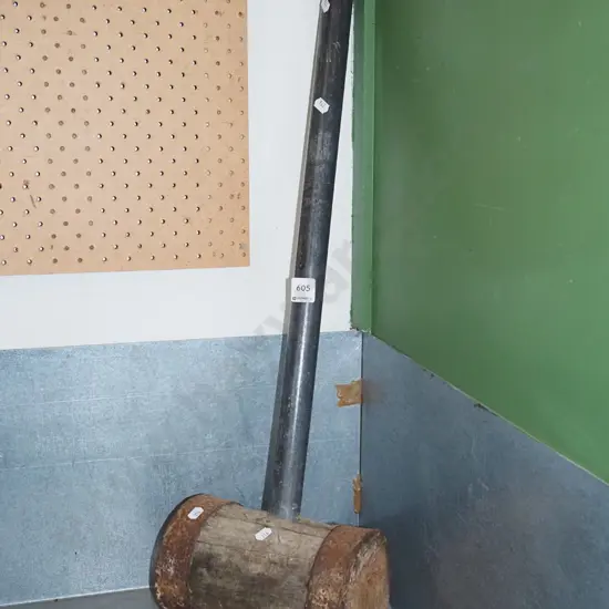 vintage wooden sledge hammer with metal pipe handle
