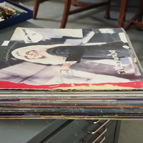 stack of LPs; King Carnes, Linda Ronstadt etc