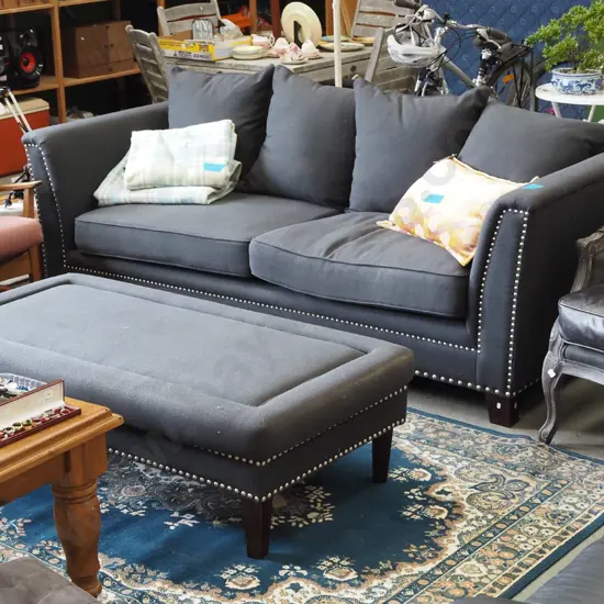 contemporary charcoal upholstered and dome edged chesterfield  3 seater settee with matching ottoman