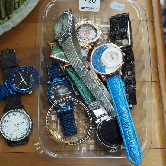 tray of wristwatches