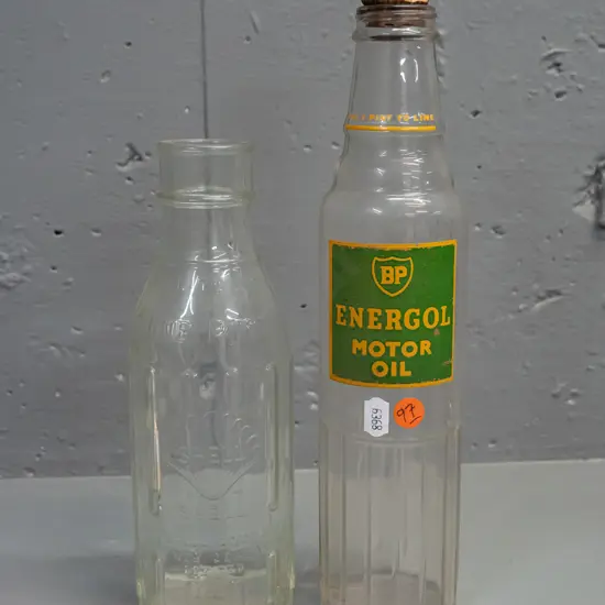 2 clear glass one pint oil bottles - BP with labelling H-290 and clear Shell New Zealand