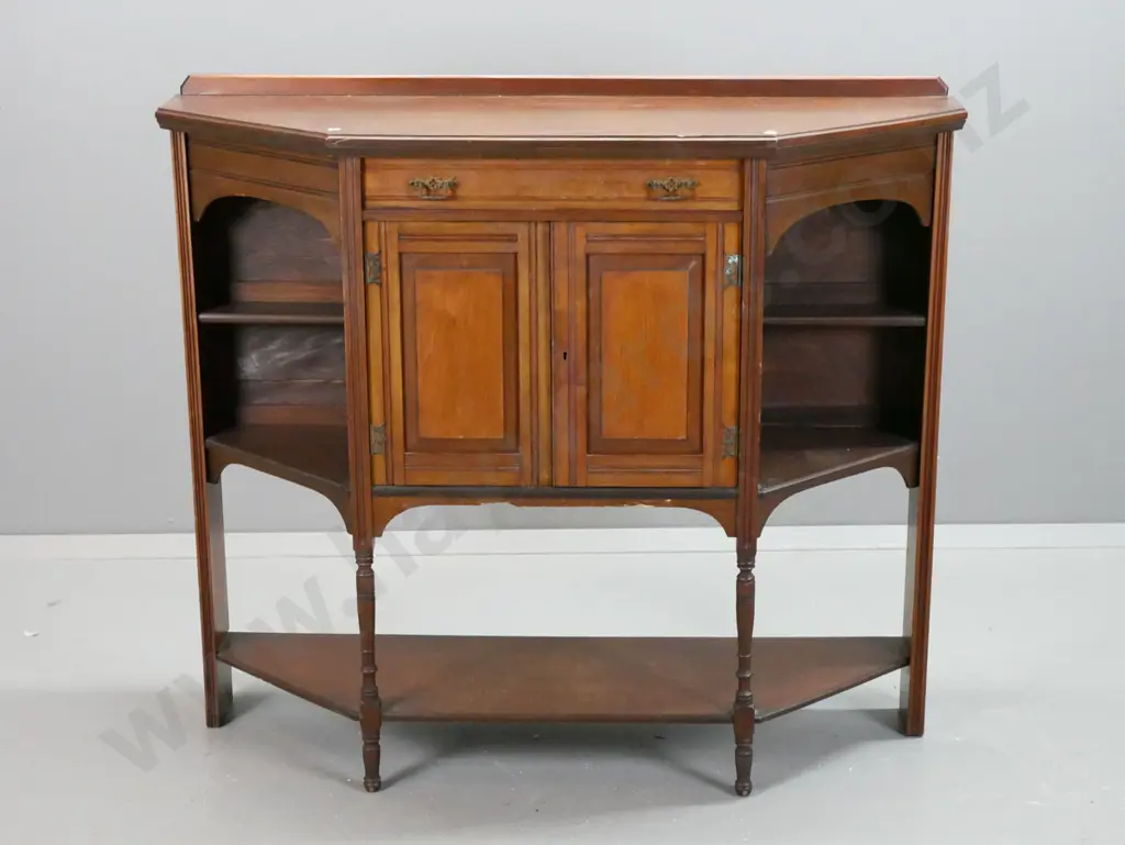 Edwardian walnut sideboard, one drawer, two panelled doors, shelves in canted sides, on turned feet w/platform base, Image 1++