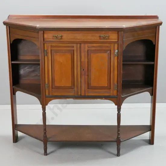 Edwardian walnut sideboard, one drawer, two panelled doors, shelves in canted sides, on turned feet w/platform base,