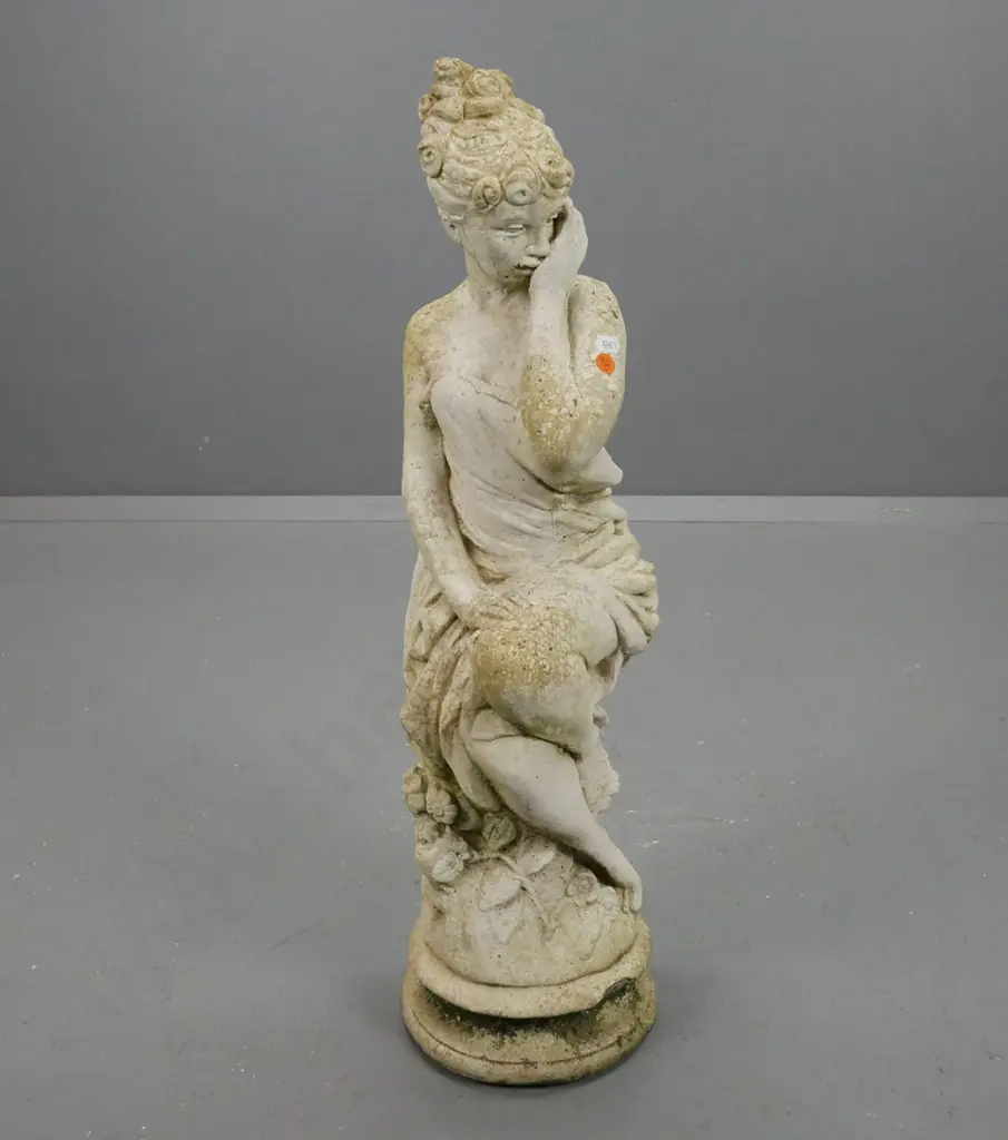Cast concrete garden statue, seated female with draped clothing, chip to circular base H670 Image 1++