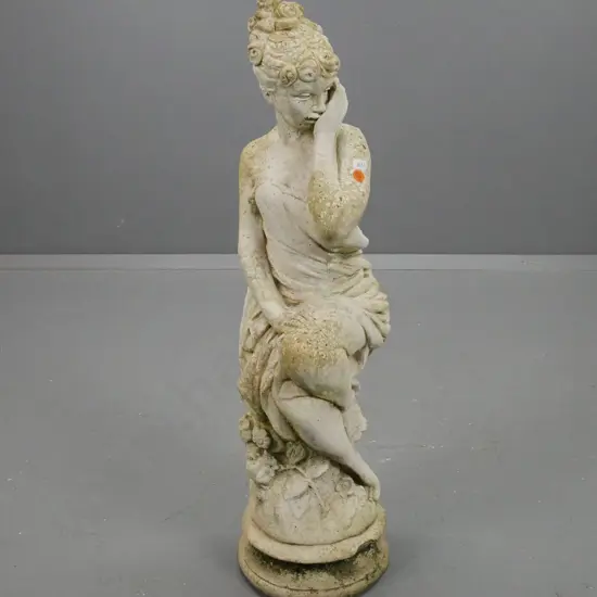 Cast concrete garden statue, seated female with draped clothing, chip to circular base H670