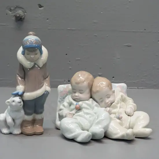 2 Lladro figurines - boy with polar bear H-145 and pair of sleeping infants on a pillow