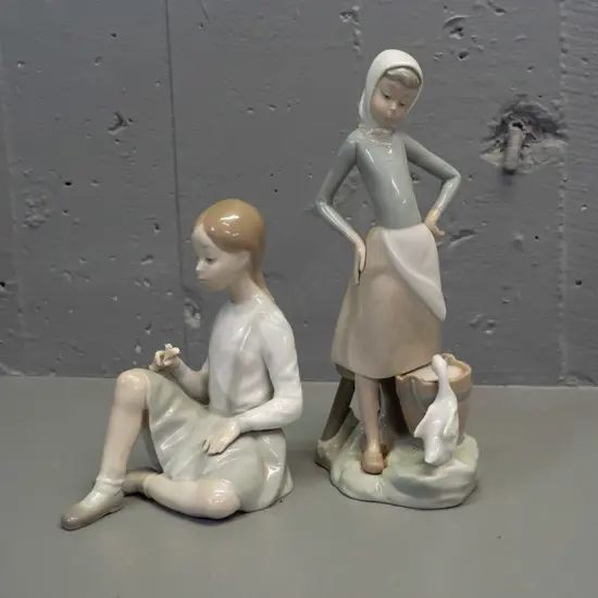 2 Lladro figurines - seated girl with flower and girl with duck H-240