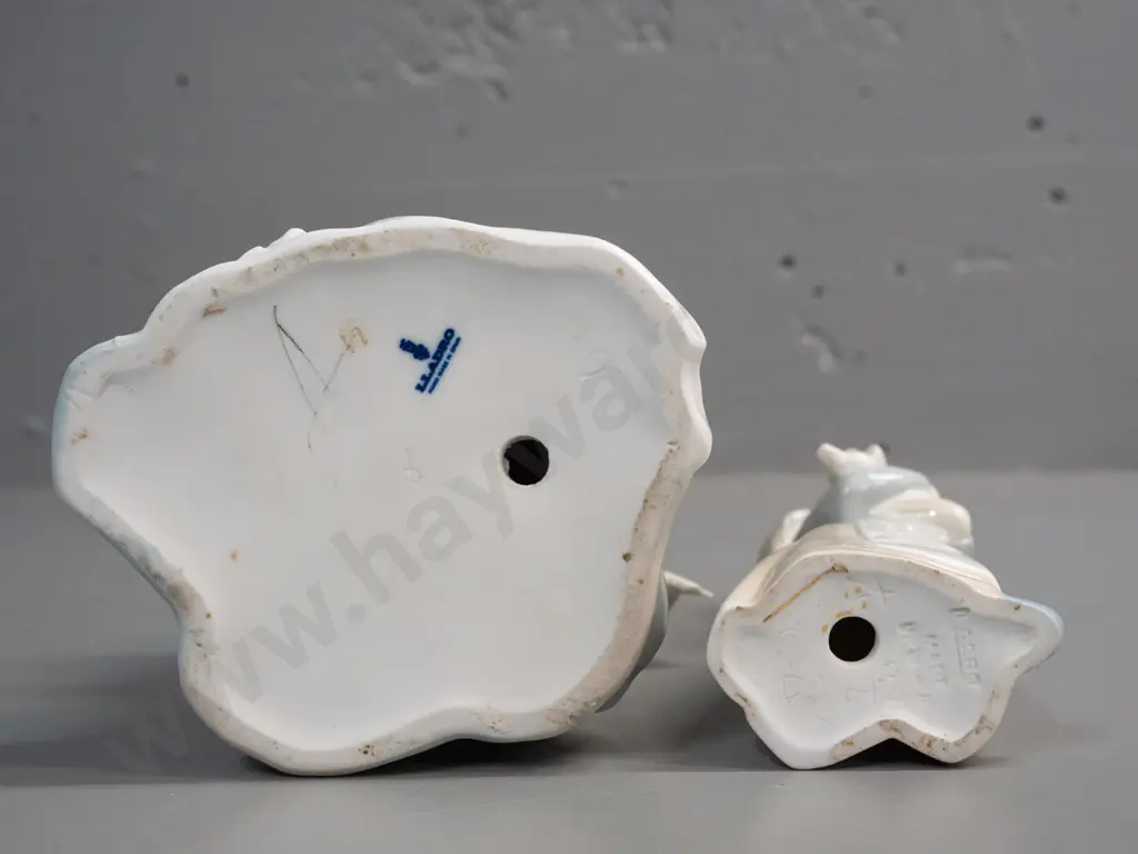 2 Lladro figurines - girl seated on a seaside rock H-235 W-110 and a girl with piglet Image 1++