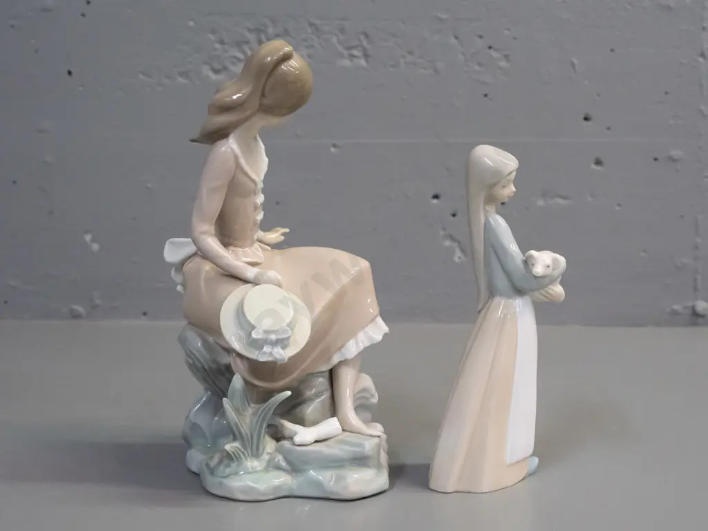 2 Lladro figurines - girl seated on a seaside rock H-235 W-110 and a girl with piglet Image 1++