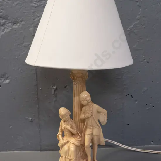 composite lamp base with Italian style fluted column & romance scene with plain conical shade - going, has a few small