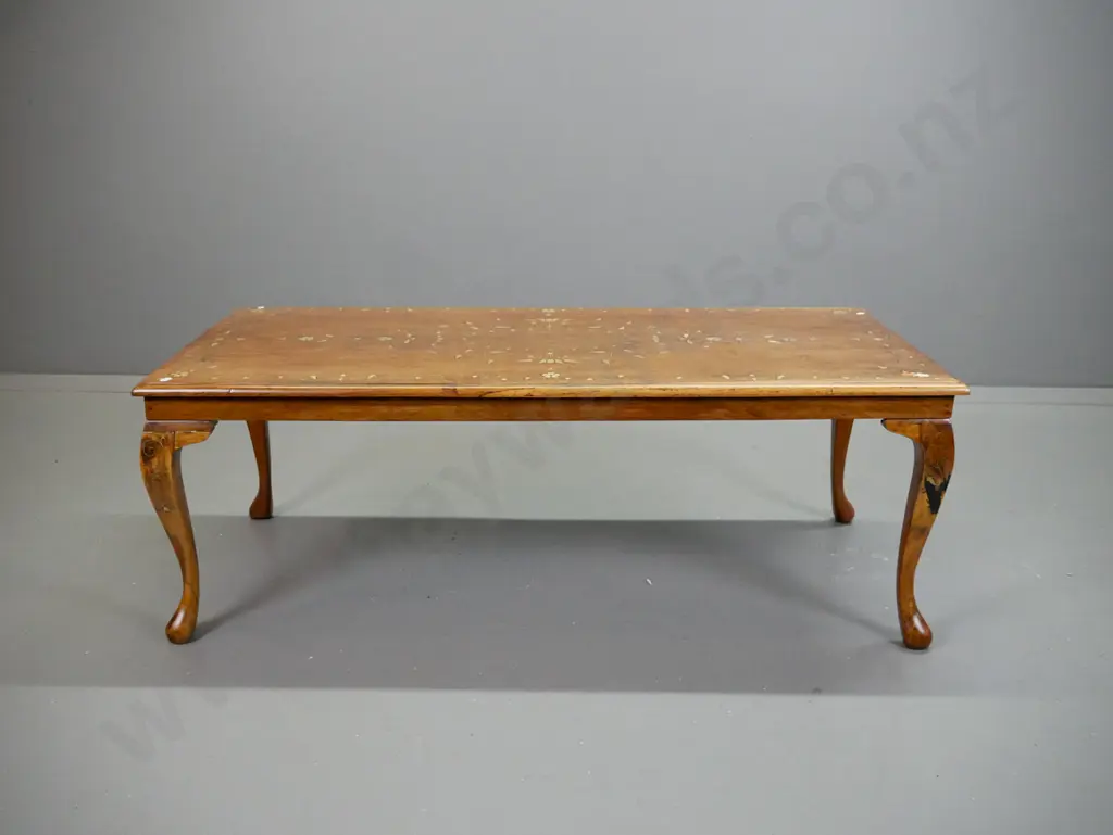 asian teak coffee table with brass scrolling inlays. Repairs to legs, dark filler repair to one leg, missing some inlay. Image 1++