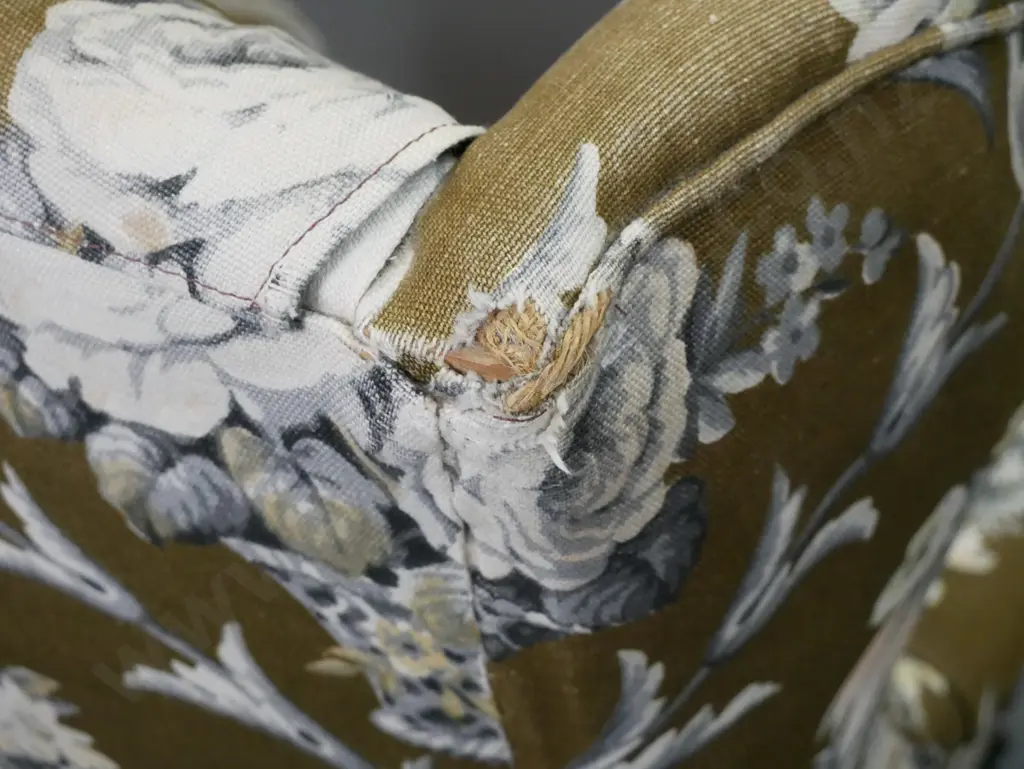 pair of mid-century floral upholstered rolled arm wingback chairs on short cab legs. Wear to top of one wing, some Image 1++