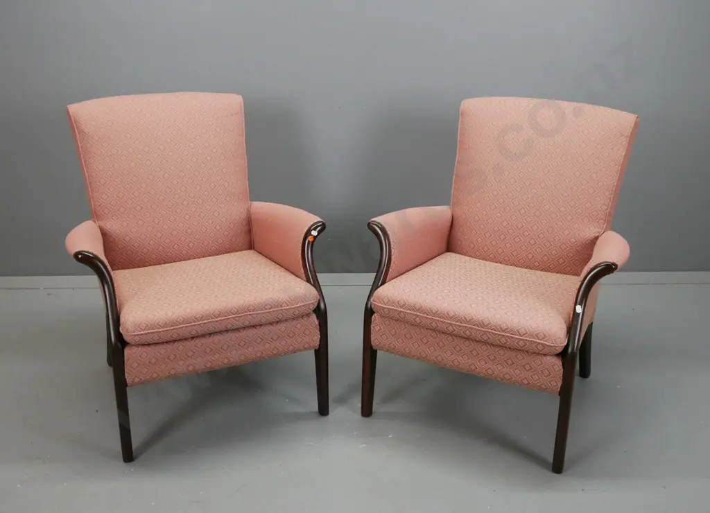 pair of Parker Knoll fireside chairs, exposed mahogany arms and legs, upholstered in salmon diamond print fabric, some Image 1++