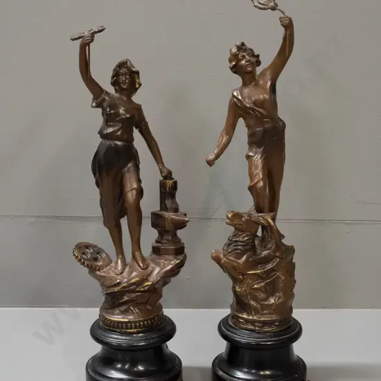 pair of spelter figures on turned wood bases - with French labels - Chasseur (Hunter) and Industrie. Both with patina'd