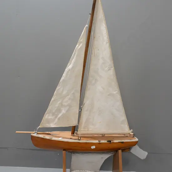 wooden pond yacht with sail on rimu stand, corrosion & deterioration to deck, staining to sail H-880 L620