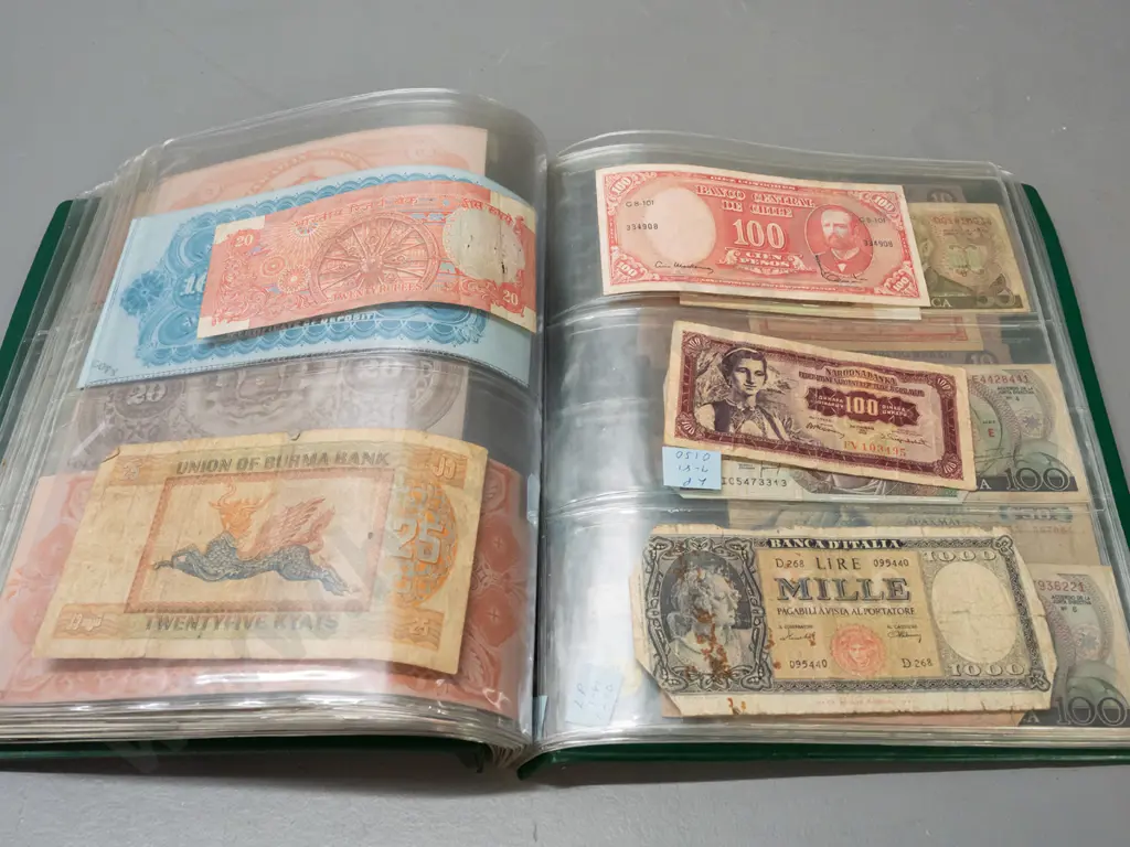 album full of assorted banknotes - a few NZ dollars, otherwise international Image 1++