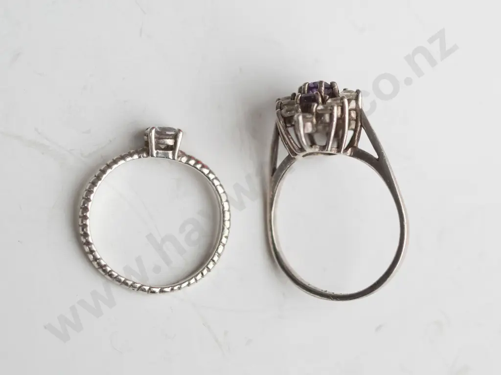 2 silver cz rings both stamped 925 Image 1++
