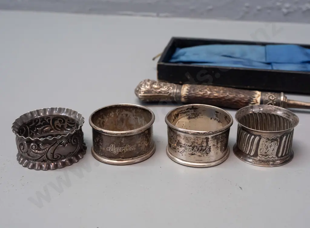 assorted silver napkin rings, sugar tongs, fork with antler handle and butter knife with greenstone handle - most marked Image 1++