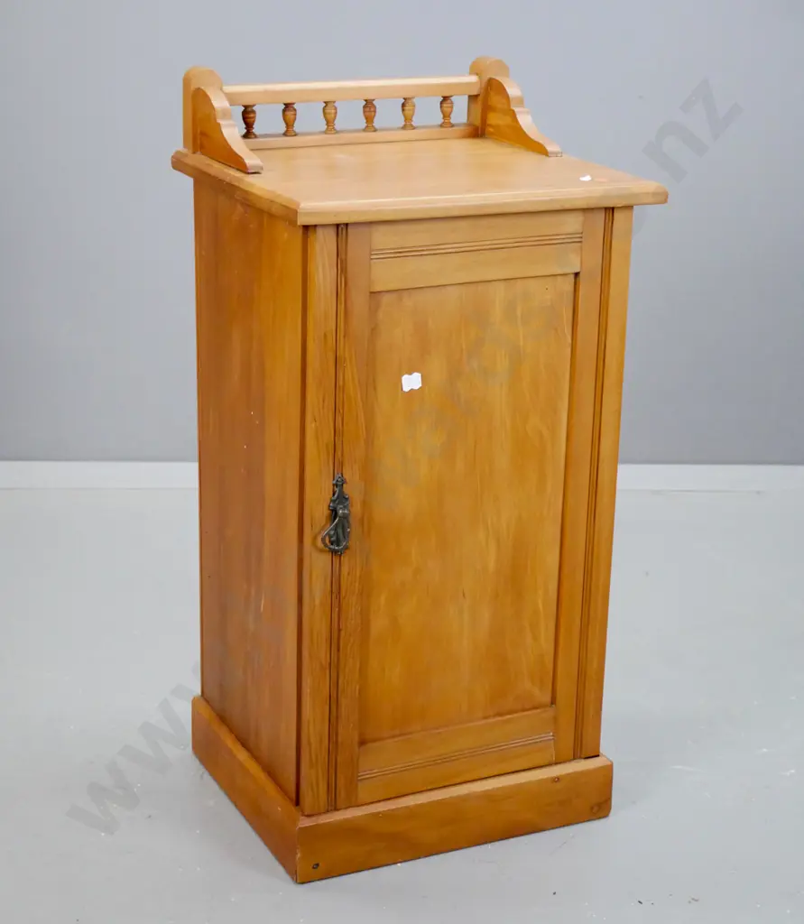 Edwardian rimu bedside cabinet with panelled door, shaped gallery with spindles - borer in bottom plate, filled borer Image 1++
