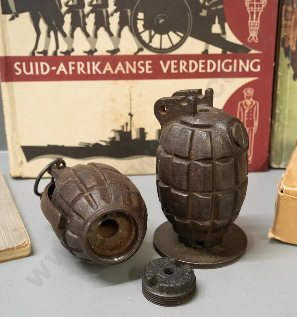 2 hand grenades, one marked JL & Co, mounted to base, no pin and the other with threaded base cap, Europe Marches Again Image 1++