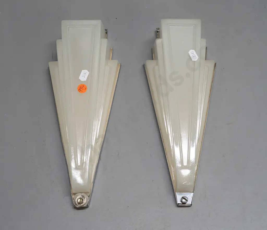pair of art deco wall mount light fittings with faceted triangular semi-opaque glass shades, chrome backing plates. One Image 1++