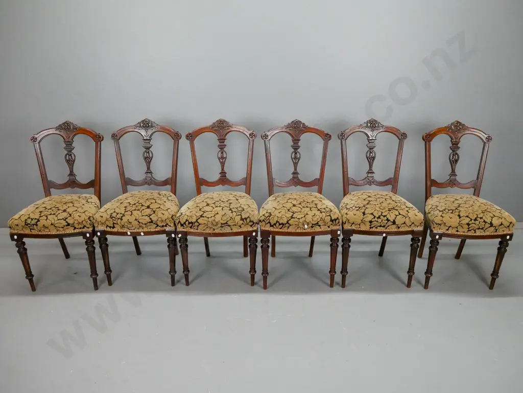 Victorian walnut dining table, with boxwood foliate inlaid top, carved foliate edge, above 4 point Image 1++