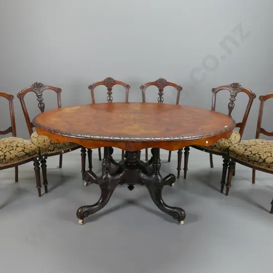 Victorian walnut dining table, with boxwood foliate inlaid top, carved foliate edge, above 4 point