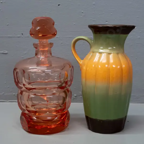 cranberry glass heavy geometric faceted and stoppered decanter - chip to stopper - and a Crown Lynn Phillipines 3-tone