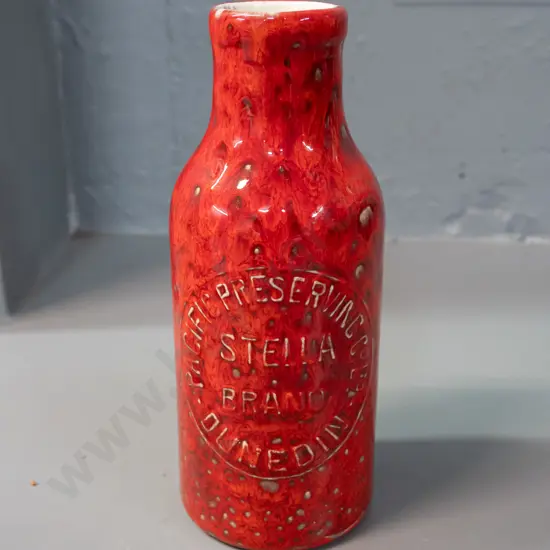 trickle glaze pottery bottle with Stella Brand Pacific Preserving Dunedin marks - reproduction cast from bottle? H-190