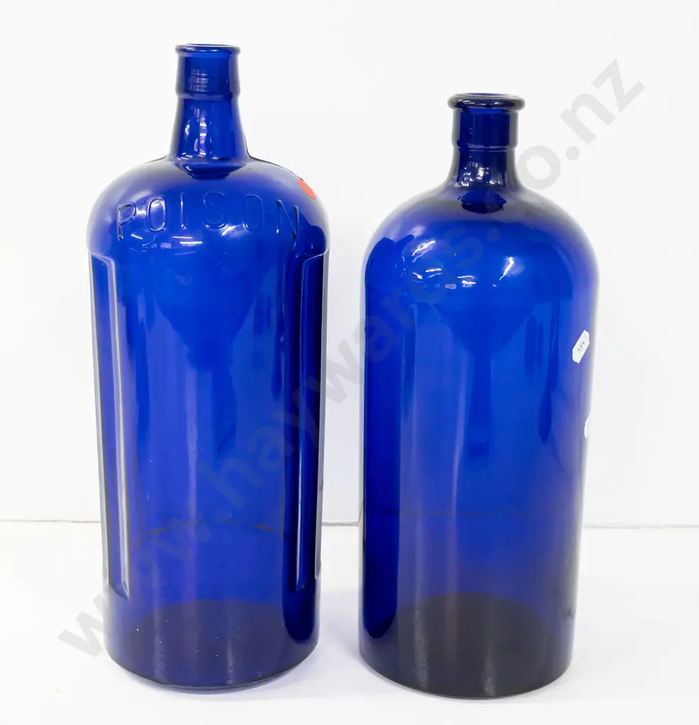 2 large Bristol blue glass bottles, one marked Poison on shoulder H-340, other with faint scratched markings, Image 1++