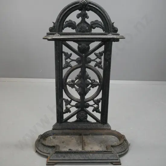 cast metal, Victorian style umbrella/stick stand with arched pierced foliate back on shaped base with lift out drip tray