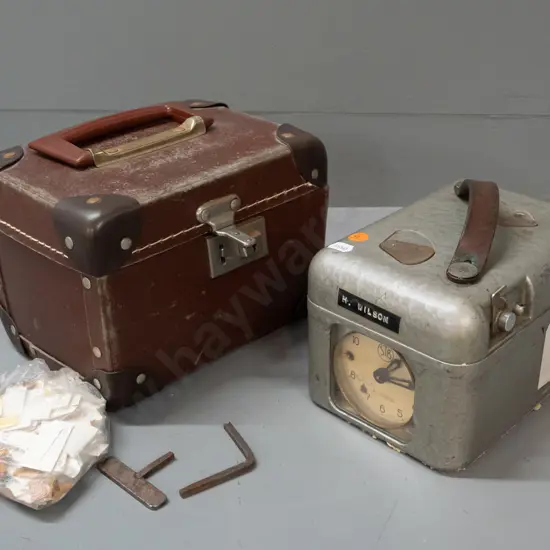 STB Swiss pigeon-racing time clock with carry case and bag of paper tags - some wear, decaying foam residue from case.
