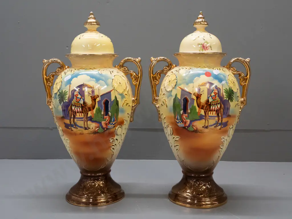 pair of Falconware lidded handled vases with Egyptian scenes & gilt decoration - repair to one finial, some wear to gilt Image 1++