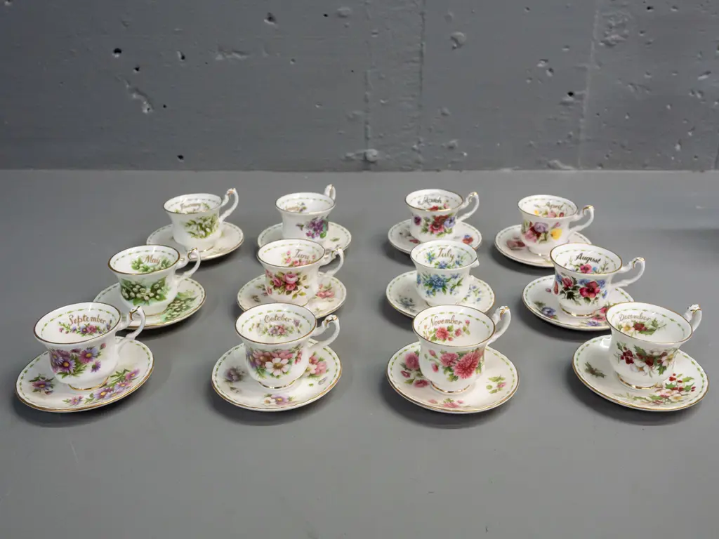set of 12 Royal Albert months of the year miniature cups & saucers, unique patterns, all months present but July cup has Image 1++