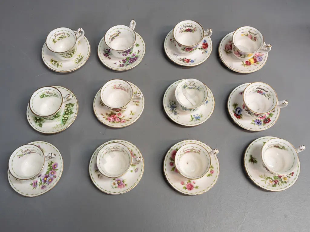 set of 12 Royal Albert months of the year miniature cups & saucers, unique patterns, all months present but July cup has Image 1++