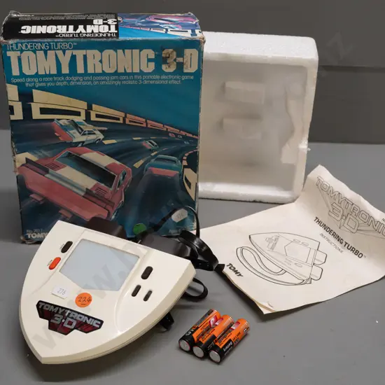 Tomytronic 3-D hand-held game with original box and instruction pamphlet - powers up, battery contacts are clean