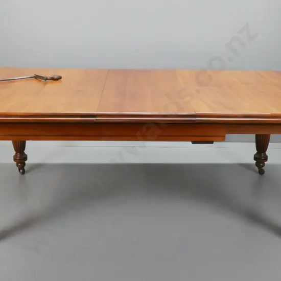 Victorian colonial kauri & rimu wind-out dining table with turned fluted legs, porcelain casters, single leaf, has been