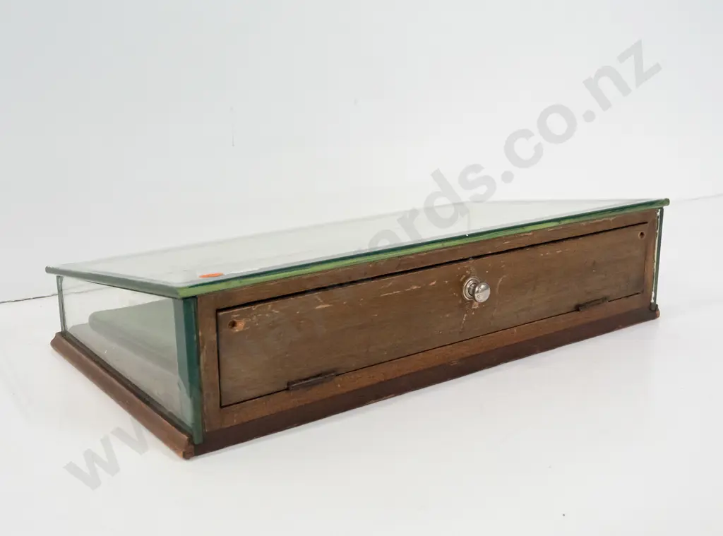 glazed slope fronted counter jewellery display case with hinged mirrored back, felt-lined. Some chipping to edge of Image 1++