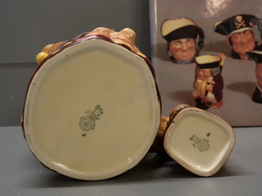 2 Royal Doulton character jugs and a book by Desmond Eyles - larger Touchstone H- 155 and smaller Mr. Micawber H-110 Image 1++