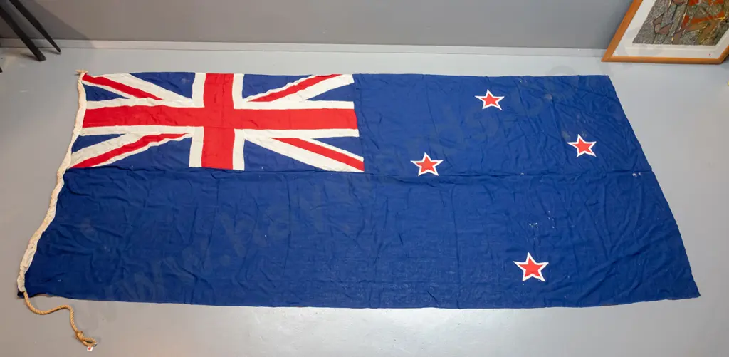 very large New Zealand flag with rope and toggle - has "Sargood Son & Ewen" written on binding. Staining, wear and holes Image 1++