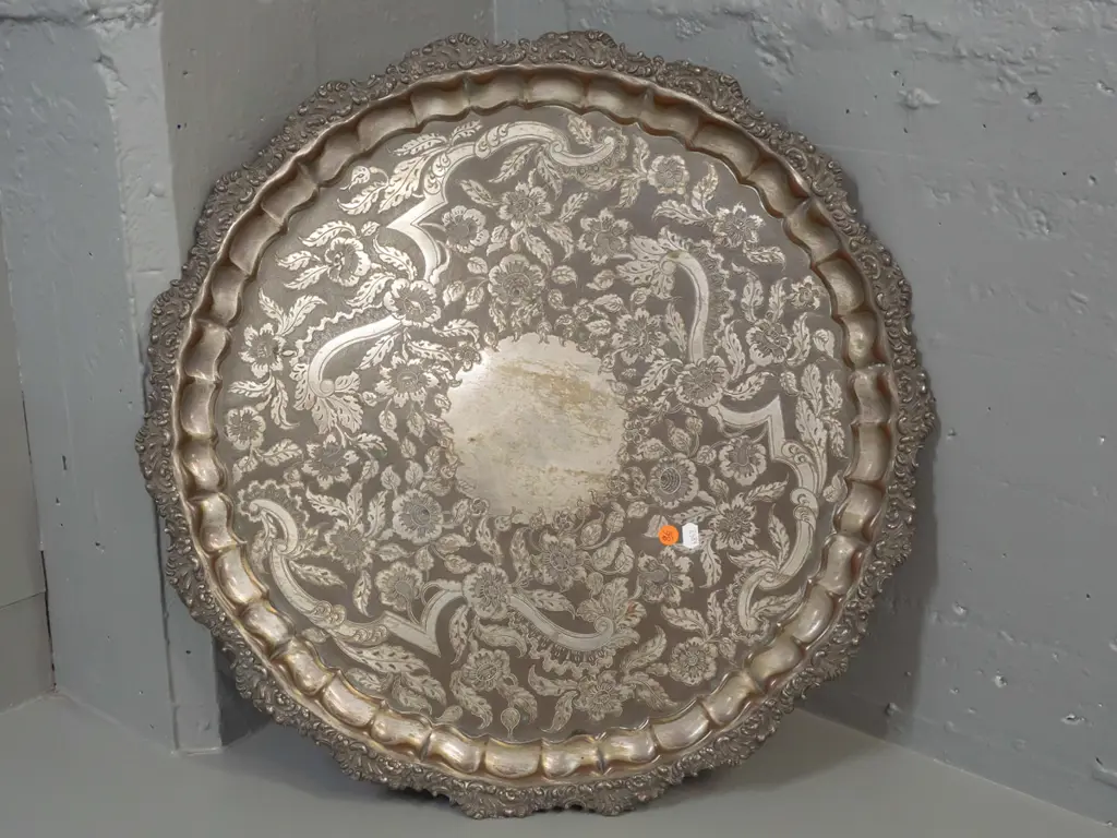 large silver plated circular footed serving tray with 3 scrolling feet and scroll shaped edge - some copper showing Image 1++